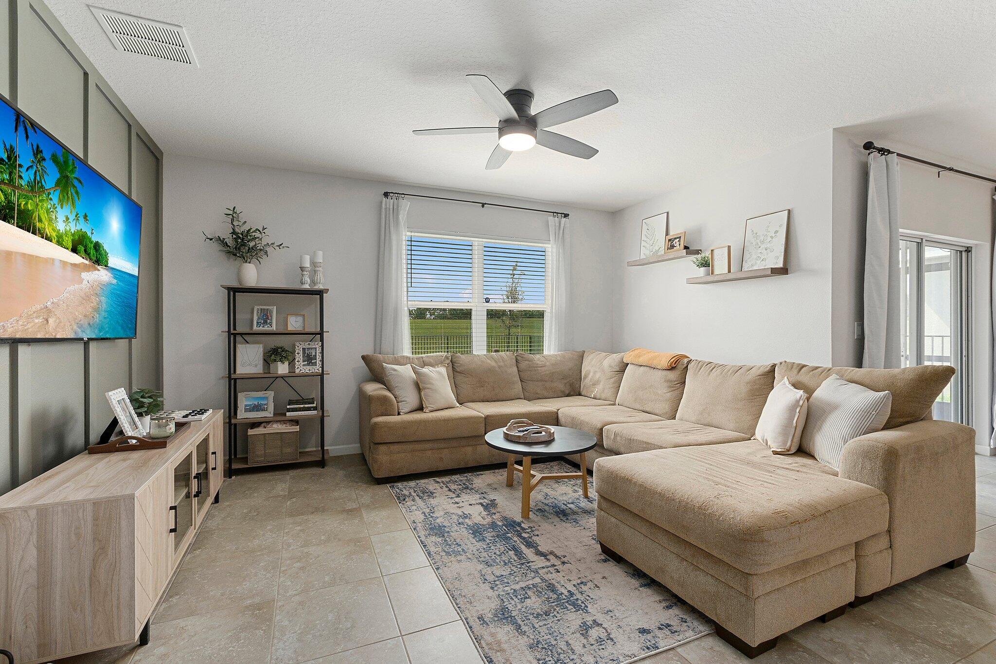 10850 Pacini Way Port St. Lucie, FL 34987 - Photo 14 of 36 a living room with furniture and a window