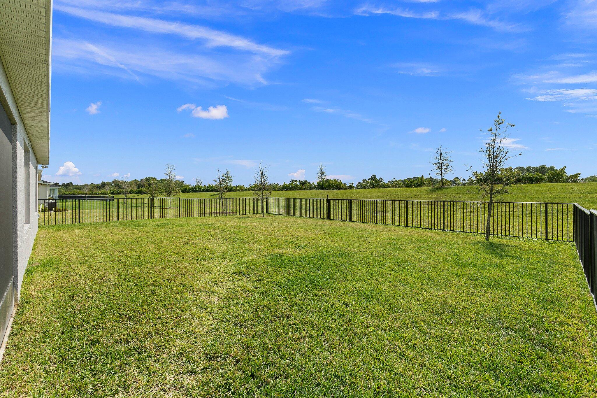 10850 Pacini Way Port St. Lucie, FL 34987 - Photo 32 of 36 a view of a golf course with a lake view