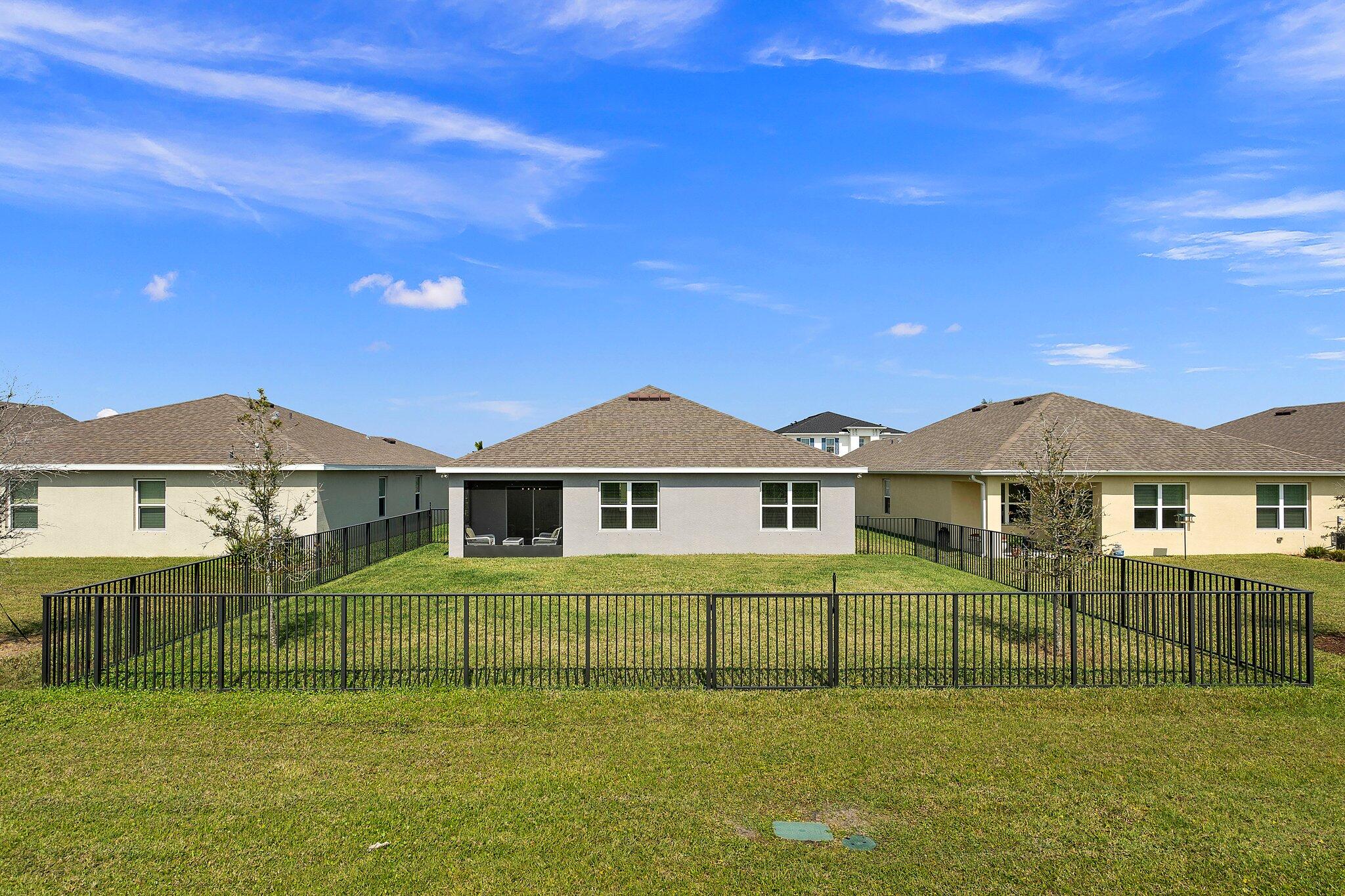 10850 Pacini Way Port St. Lucie, FL 34987 - Photo 33 of 36 a front view of a house with a garden