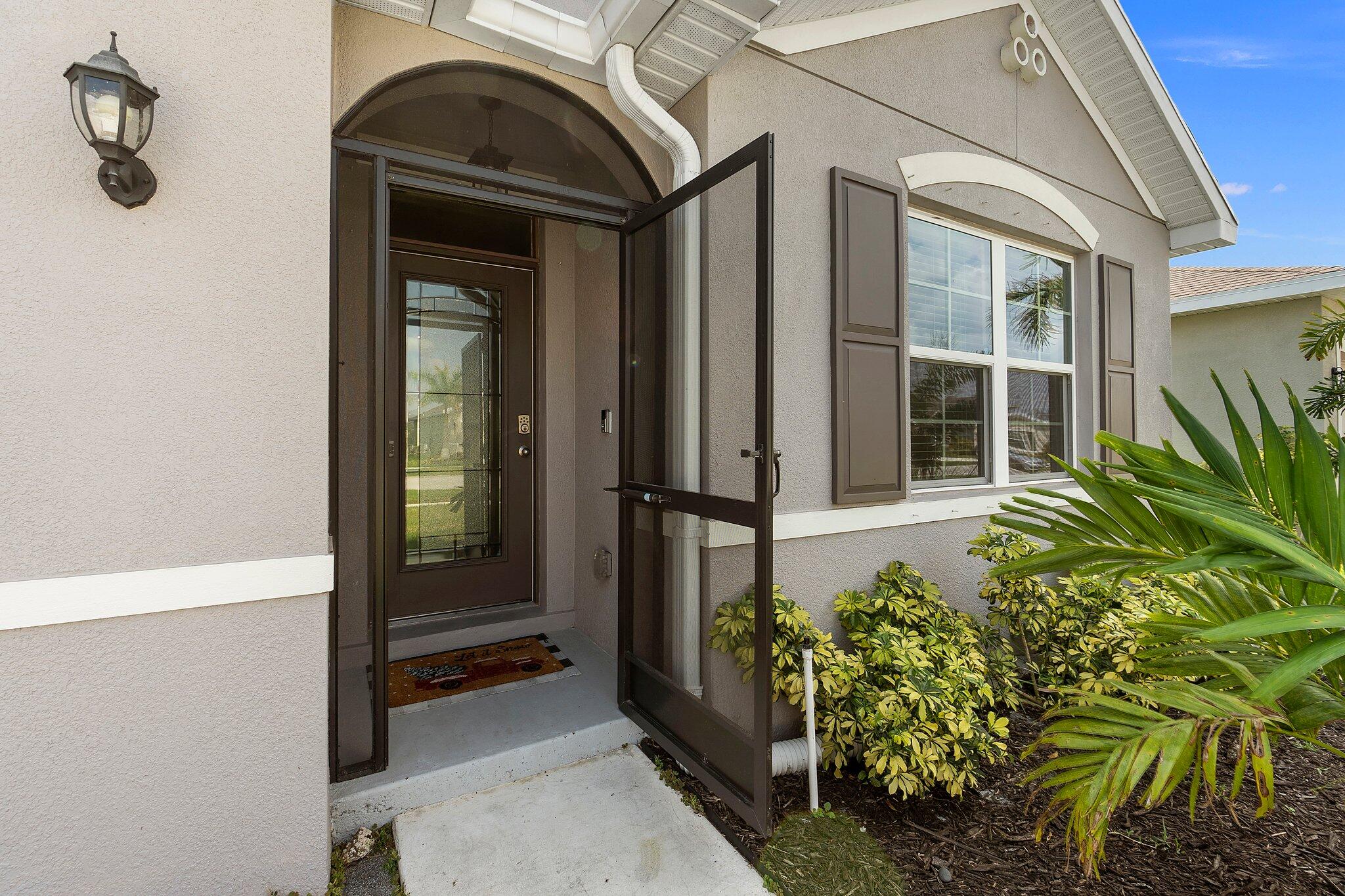 10850 Pacini Way Port St. Lucie, FL 34987 - Photo 6 of 36 a view of front door