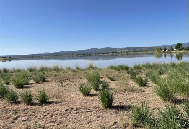 a view of a lake and a mountain in the background