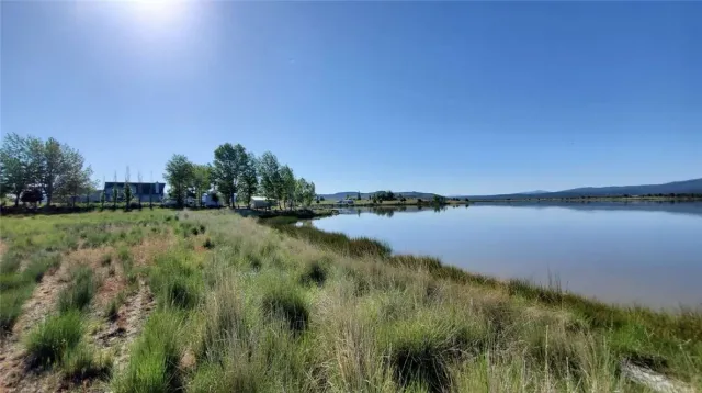 a view of lake with green space