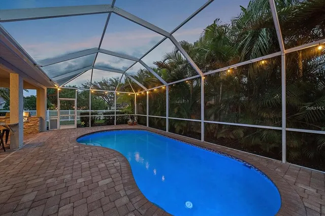 a view of a swimming pool with a lounge chairs