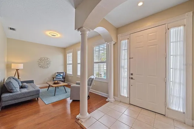 a living room with furniture and a table