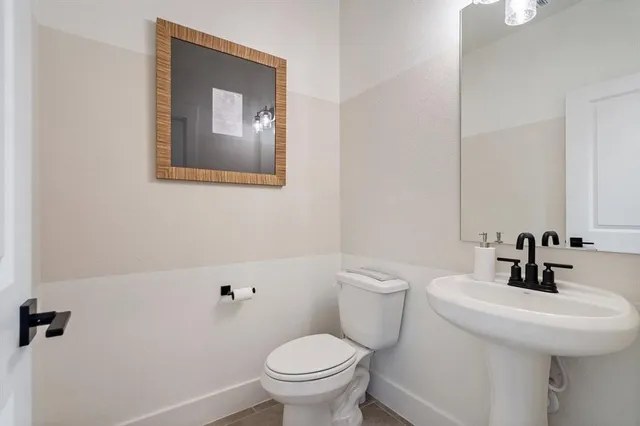 a bathroom with a toilet and sink