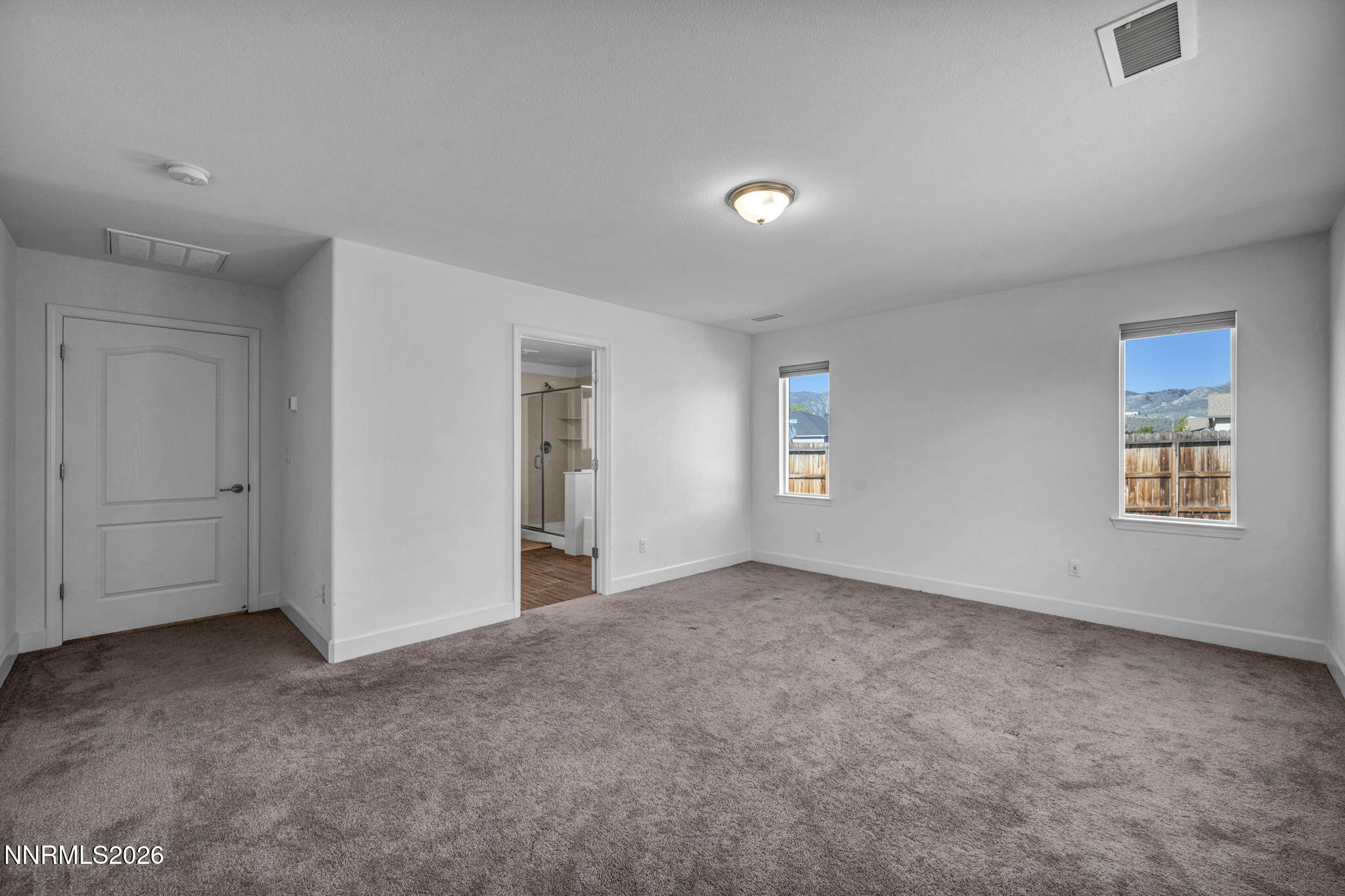 7181 Saddlehorn Road Carson City, NV 89701 - Photo 36 of 62 an empty room with a empty space and windows