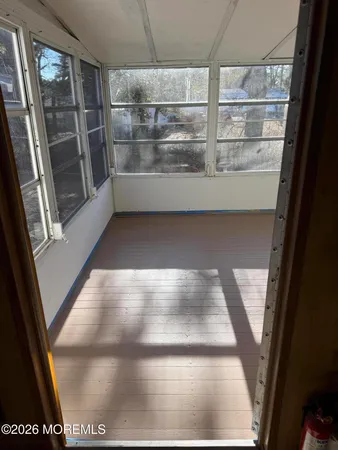 a view of an empty room with a balcony