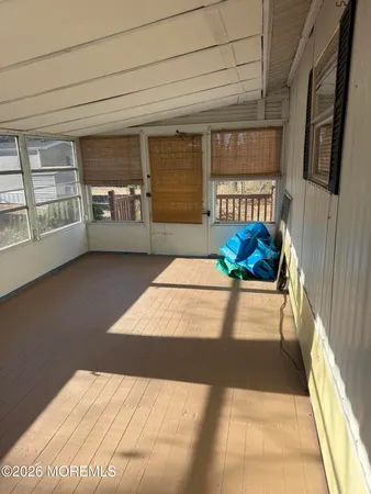 a view of an empty room with a fireplace