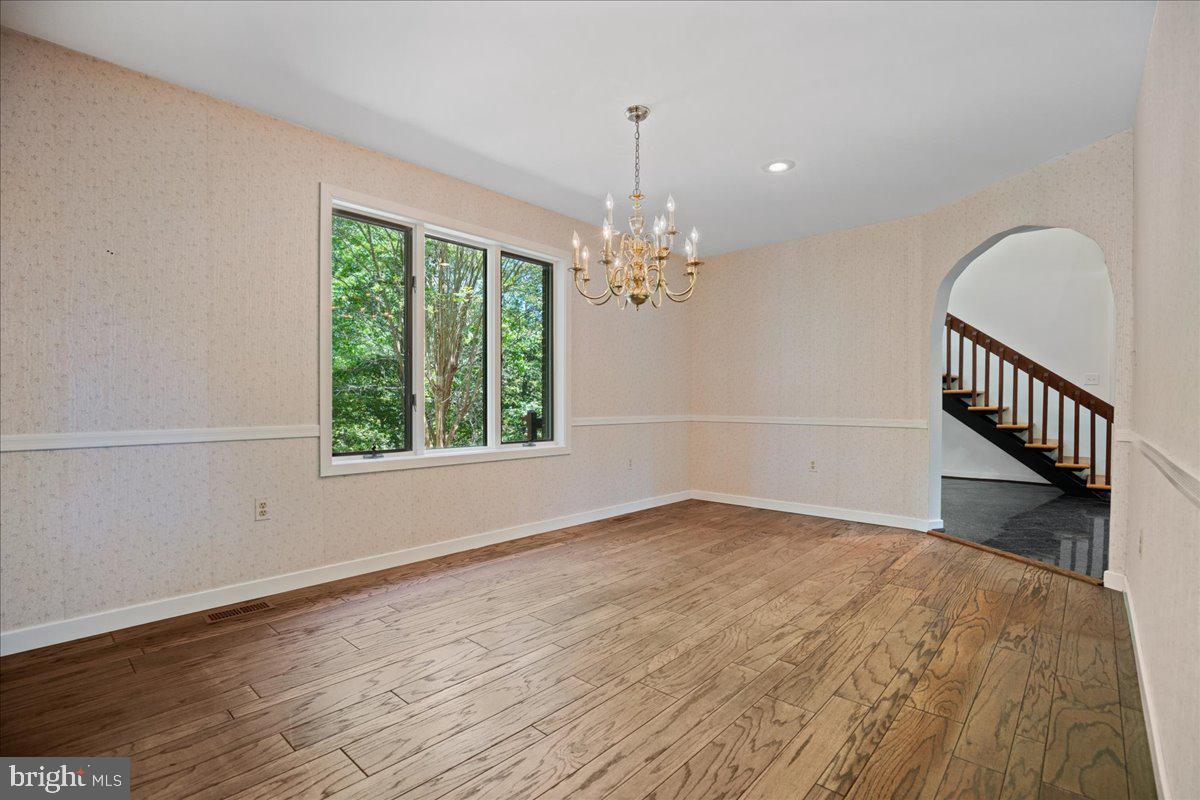 8438 Mackall Road St. Leonard, MD 20685 - Photo 15 of 68 Formal dining room with hardwood floors.