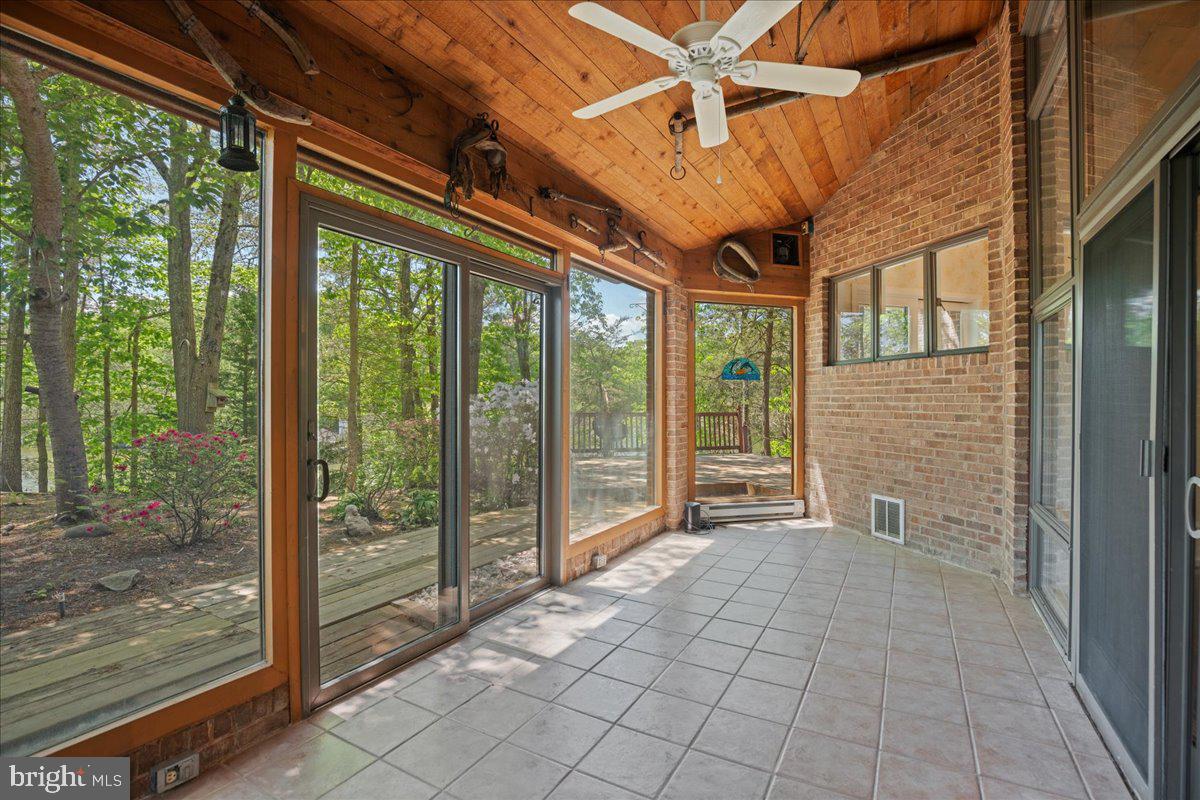8438 Mackall Road St. Leonard, MD 20685 - Photo 19 of 68 Glass porch or sunroom with creek and garden view!