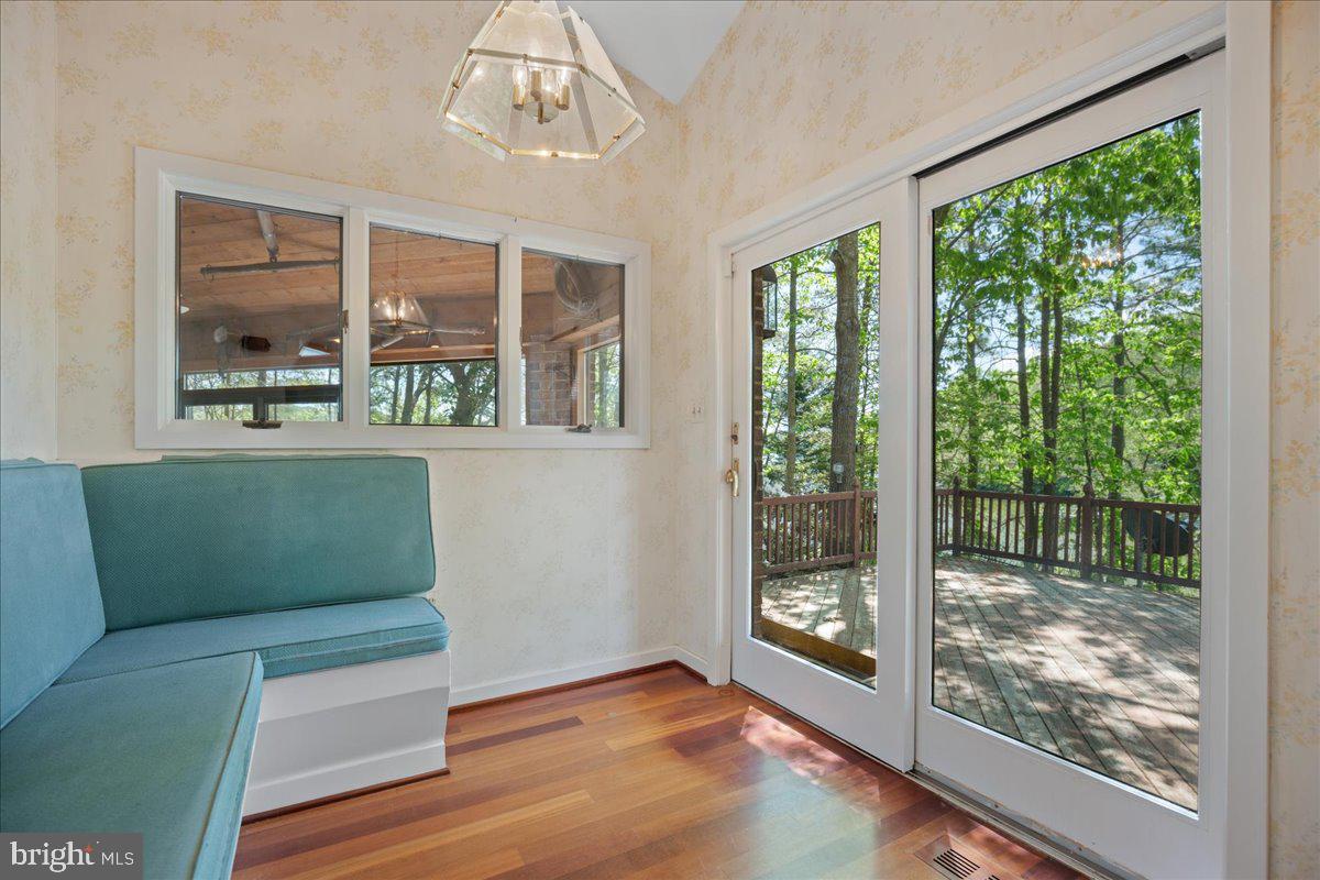 8438 Mackall Road St. Leonard, MD 20685 - Photo 28 of 68 Breakfast nook off the kitchen leading to decks.