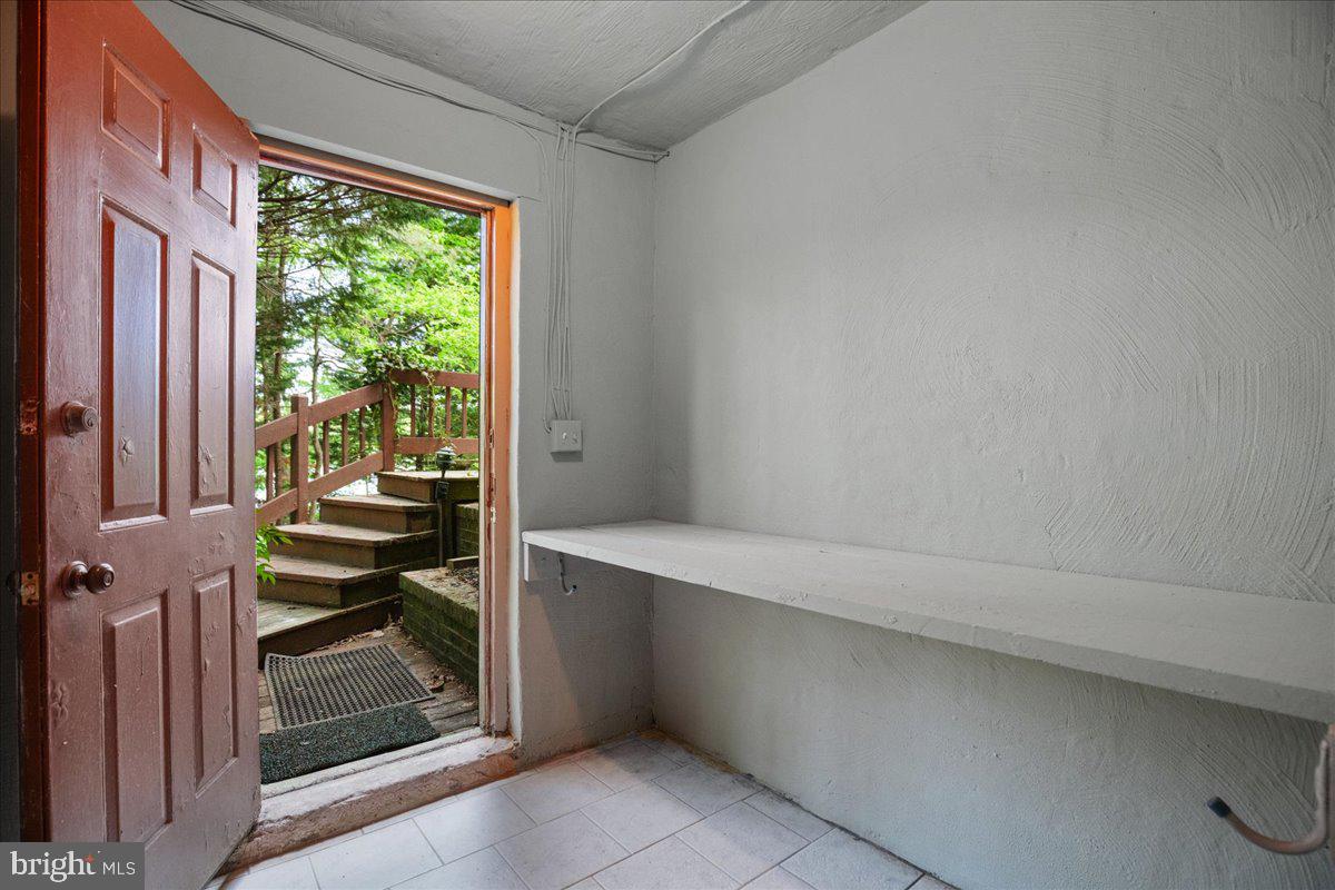 8438 Mackall Road St. Leonard, MD 20685 - Photo 58 of 68 Access lower level for great boat supply storage