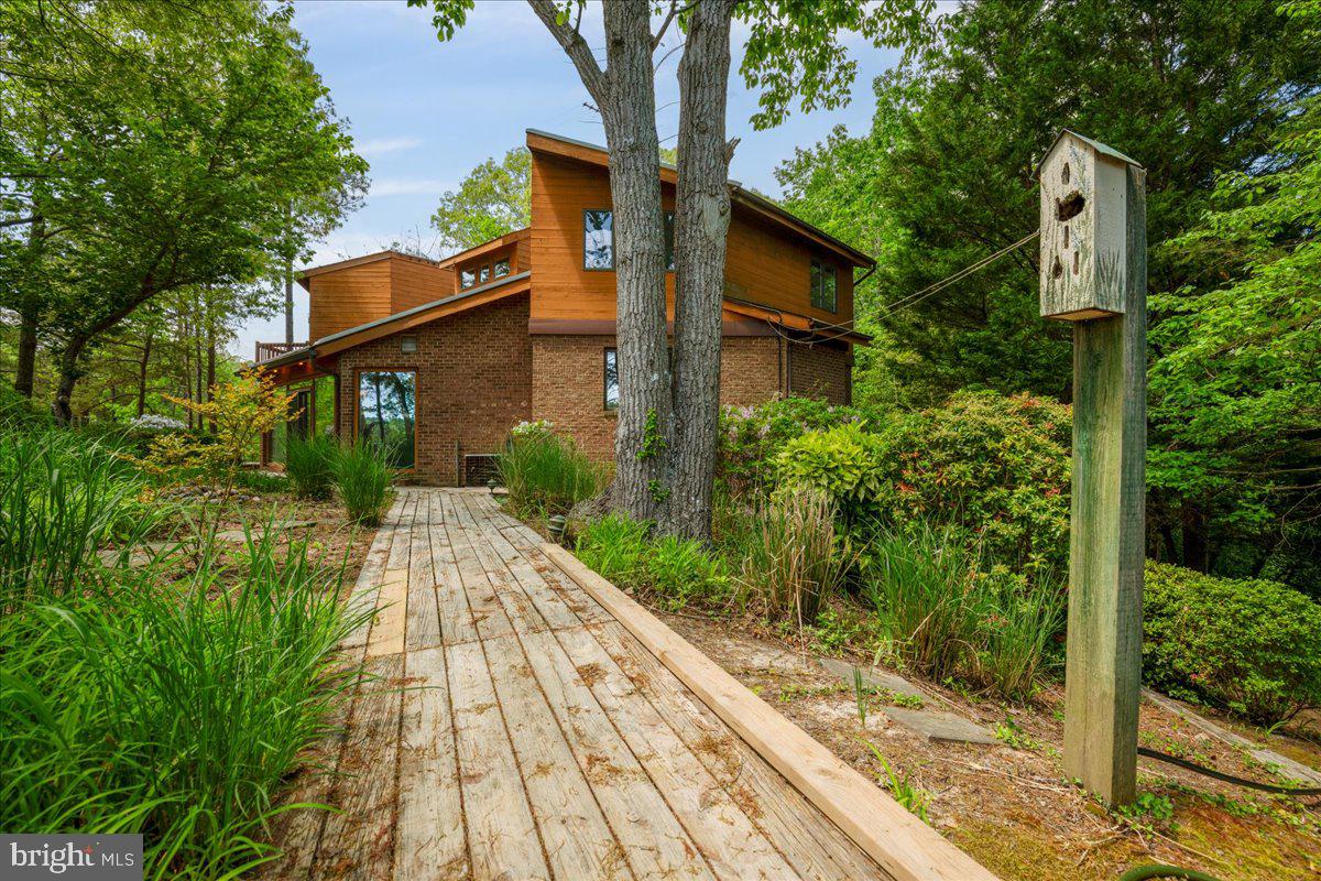 8438 Mackall Road St. Leonard, MD 20685 - Photo 62 of 68 Walking back from the pier and garden