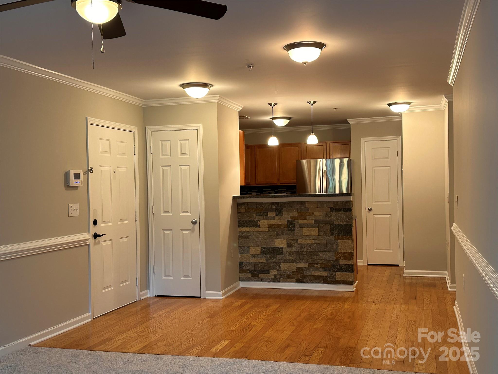 5236 Hilltop Road Jamestown, NC 27282 - Photo 11 of 27 a view of a hallway with wooden floor