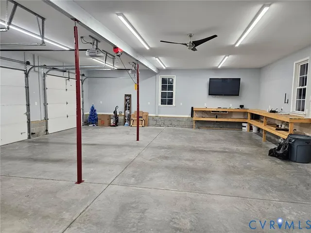 a view of a hall way with furniture