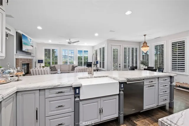 a kitchen with a sink stove and cabinets