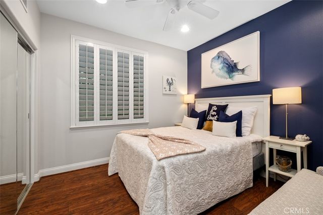 a bedroom with a bed and a night stand