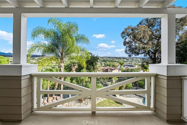 a view of balcony with furniture and garden