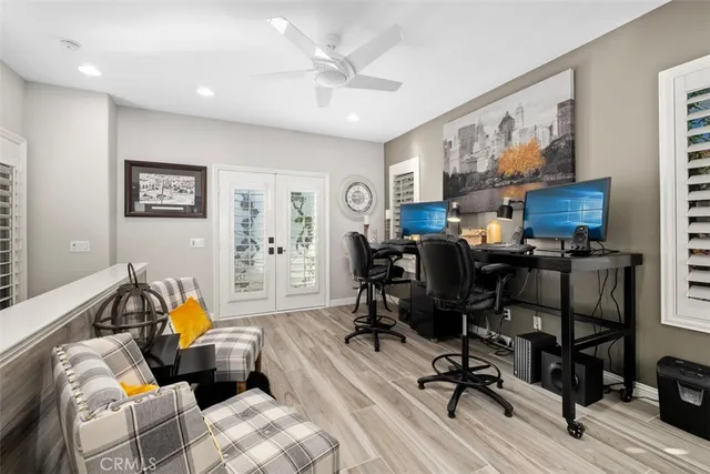 a view of a workspace with furniture and a workspace