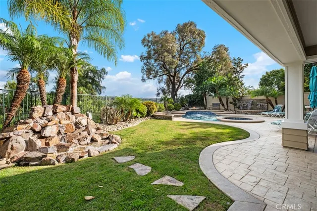 a view of a swimming pool with an outdoor space