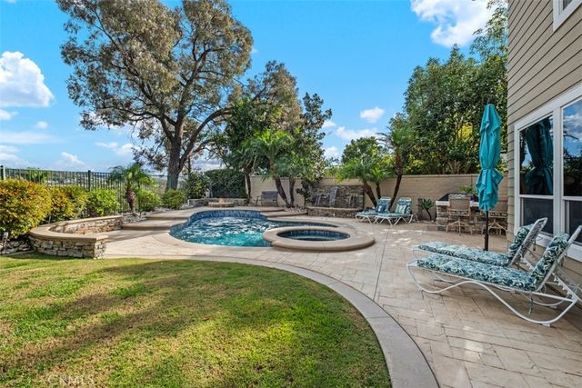 a view of a swimming pool with a patio