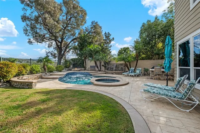 a view of a swimming pool with a patio