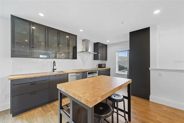 a kitchen with a table and chairs in it