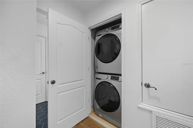 a view of a hallway with washer and dryer