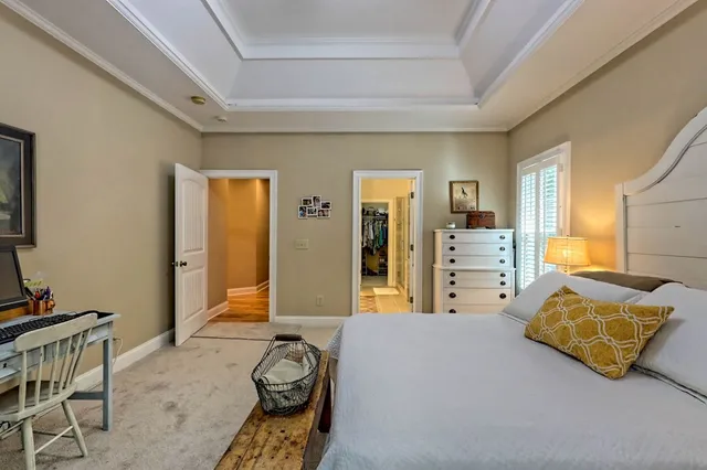 a bedroom with bed and window