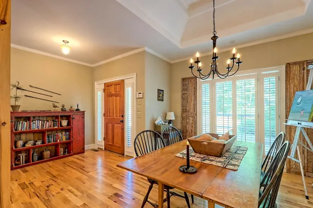 a view of a livingroom with furniture window and wooden floor