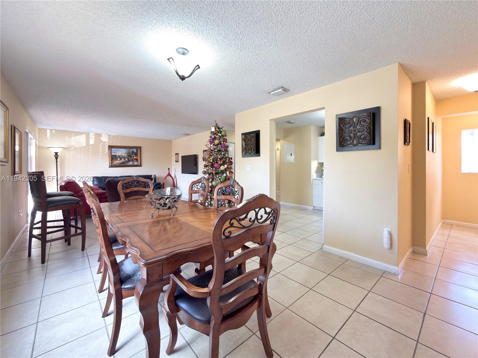 14911 Southwest 80th Street, Unit 221 Miami, FL 33193 - Photo 25 of 31 a view of a dining room with furniture