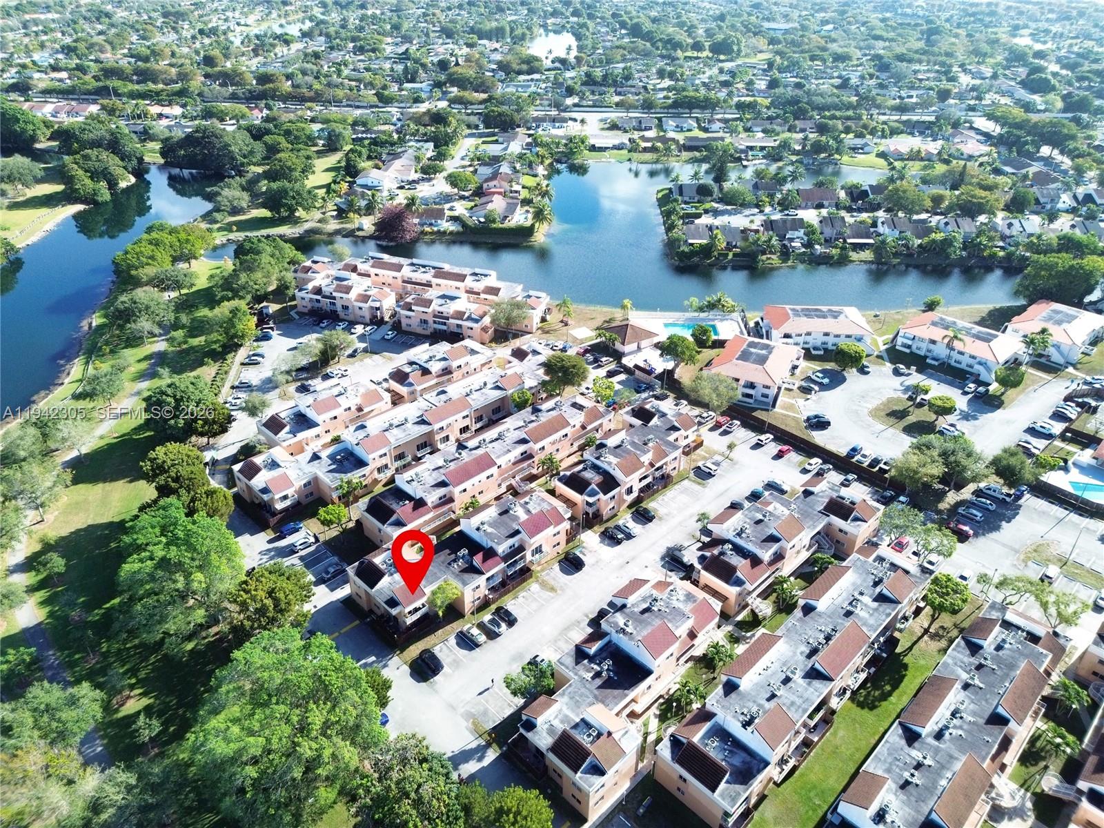 14911 Southwest 80th Street, Unit 221 Miami, FL 33193 - Photo 3 of 31 an aerial view of residential house with outdoor space and lake view