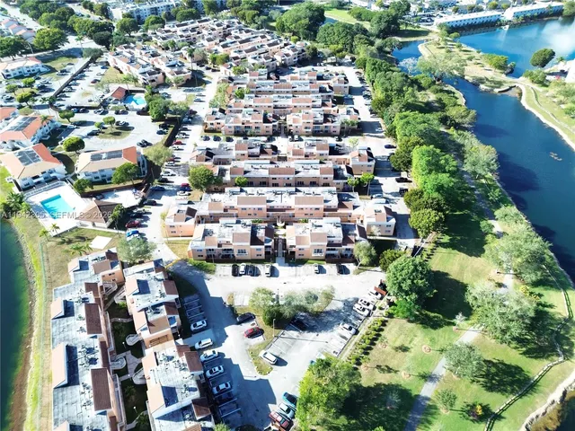 an aerial view of a house with a lake view