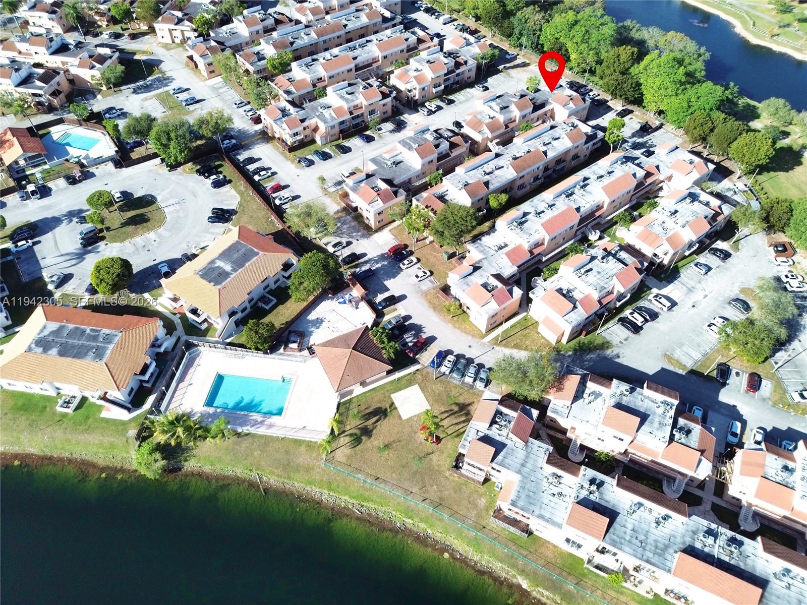 14911 Southwest 80th Street, Unit 221 Miami, FL 33193 - Photo 8 of 31 an aerial view of residential houses with yard