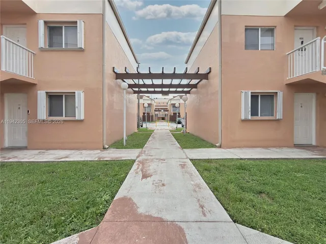 a view of a building with a yard