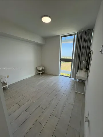 a bathroom with a shower and a sink