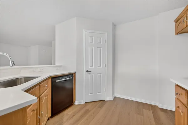 a view of a kitchen from the hallway