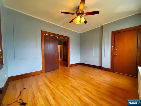 a view of an empty room with a chandelier