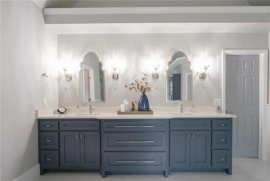 4330 Farmbrook Lane Cumming, GA 30041 - Photo 23 of 46 a bathroom with a double vanity sink and a mirror