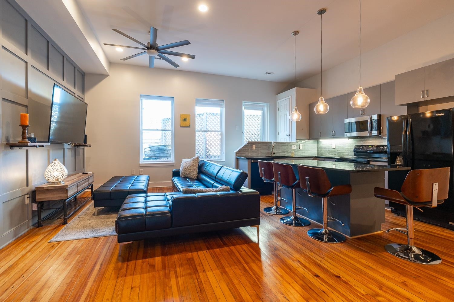 a living room with fireplace furniture and a flat screen tv