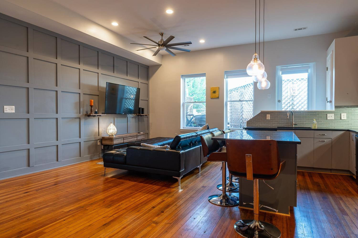 323 West Main Street, Unit B Durham, NC 27701 - Photo 2 of 14 a living room with furniture and a wooden floor