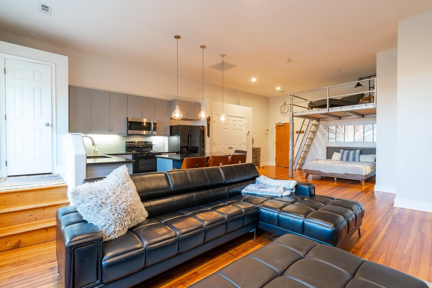 323 West Main Street, Unit B Durham, NC 27701 - Photo 4 of 14 a living room with furniture and kitchen view