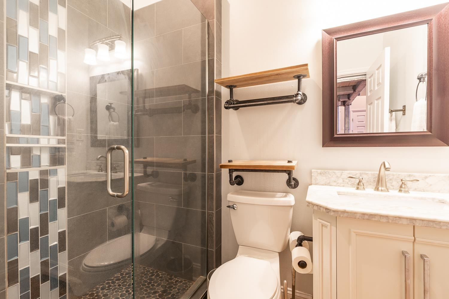 323 West Main Street, Unit B Durham, NC 27701 - Photo 9 of 14 a bathroom with a granite countertop sink toilet and shower