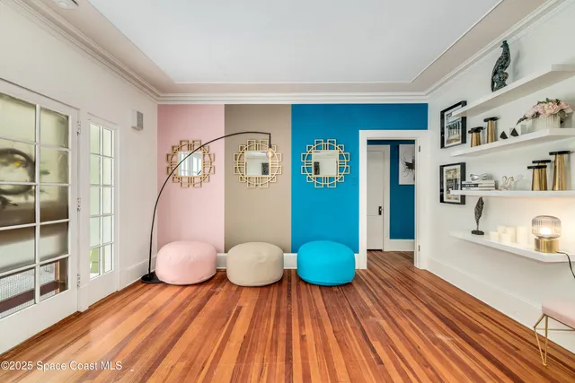 a view of room with furniture and wooden floor