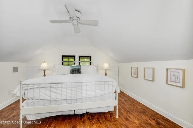 a bedroom with a bed and a night lamp