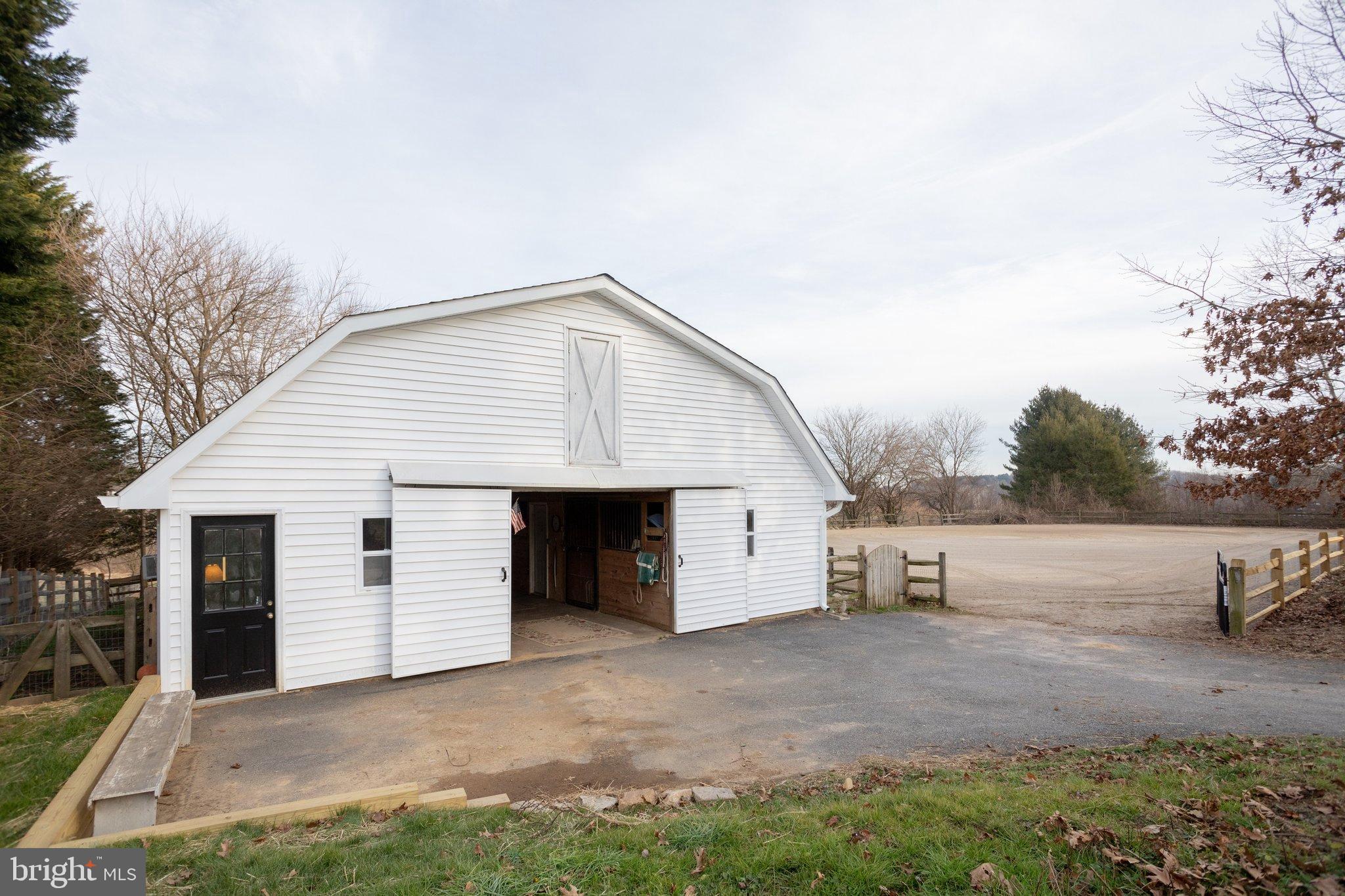 17207 Hunter Green Road Upperco, MD 21155 - Photo 37 of 56 Barn with riding arena to the right