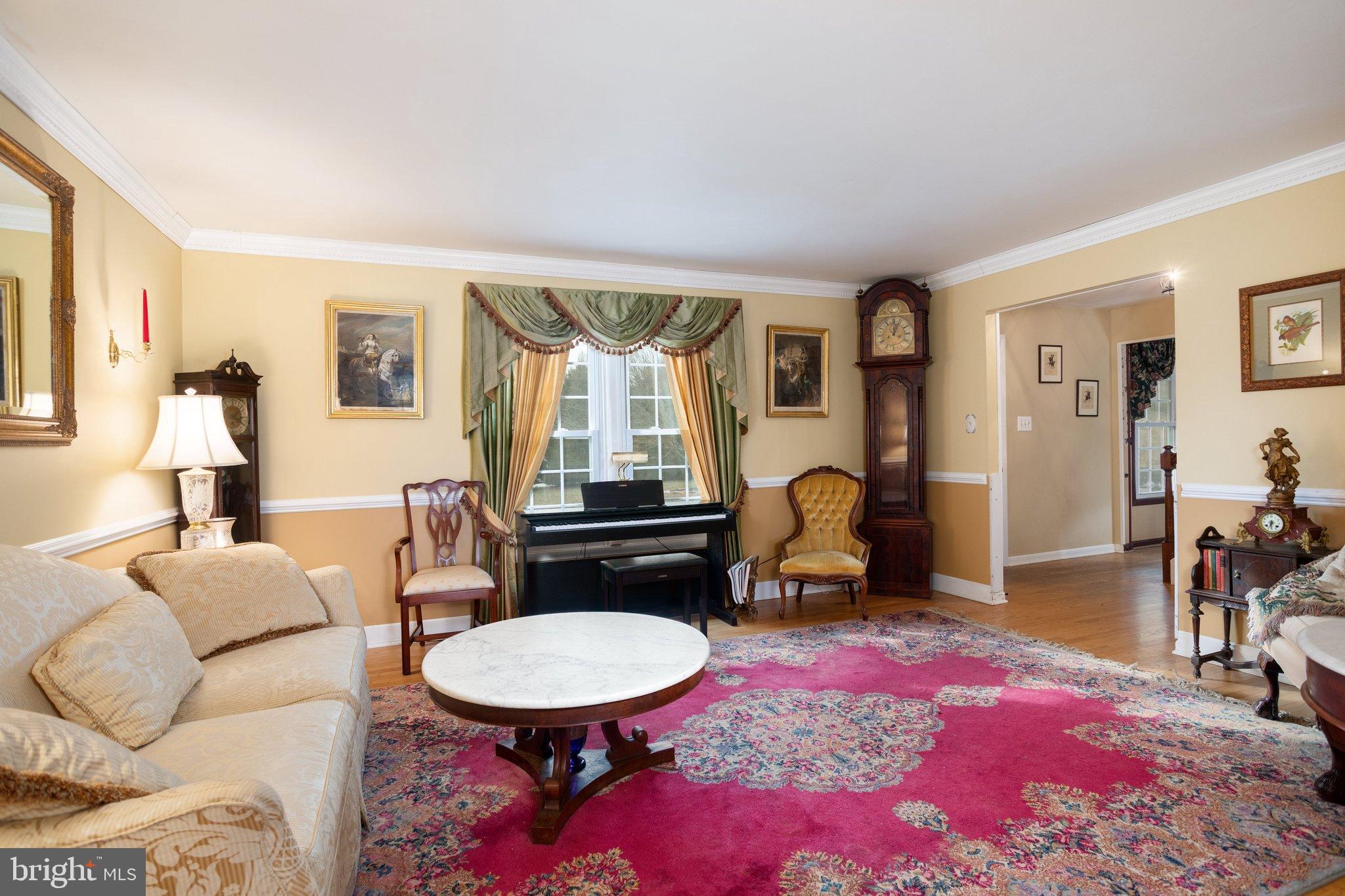 17207 Hunter Green Road Upperco, MD 21155 - Photo 7 of 56 Living Room with Chair railings and Crown moldings