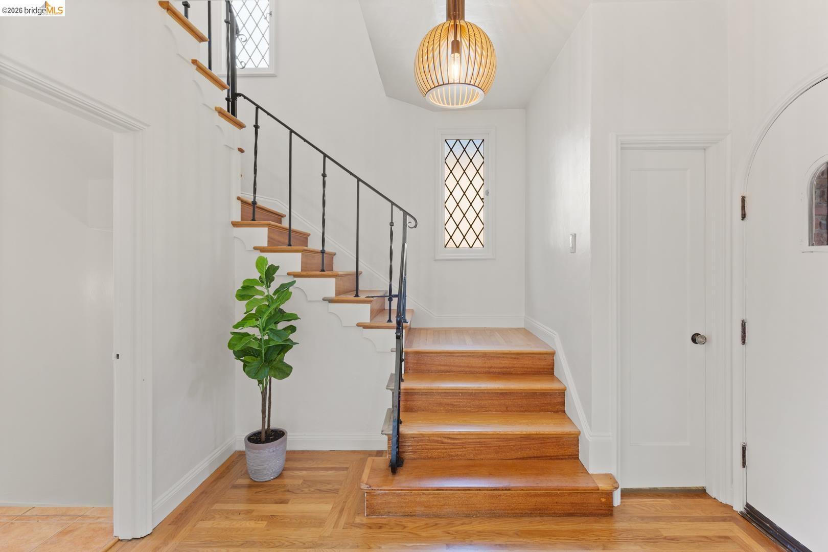 758 Spruce Street Berkeley, CA 94707 - Photo 22 of 60 Staircase featuring wood finished floors and a high ceiling