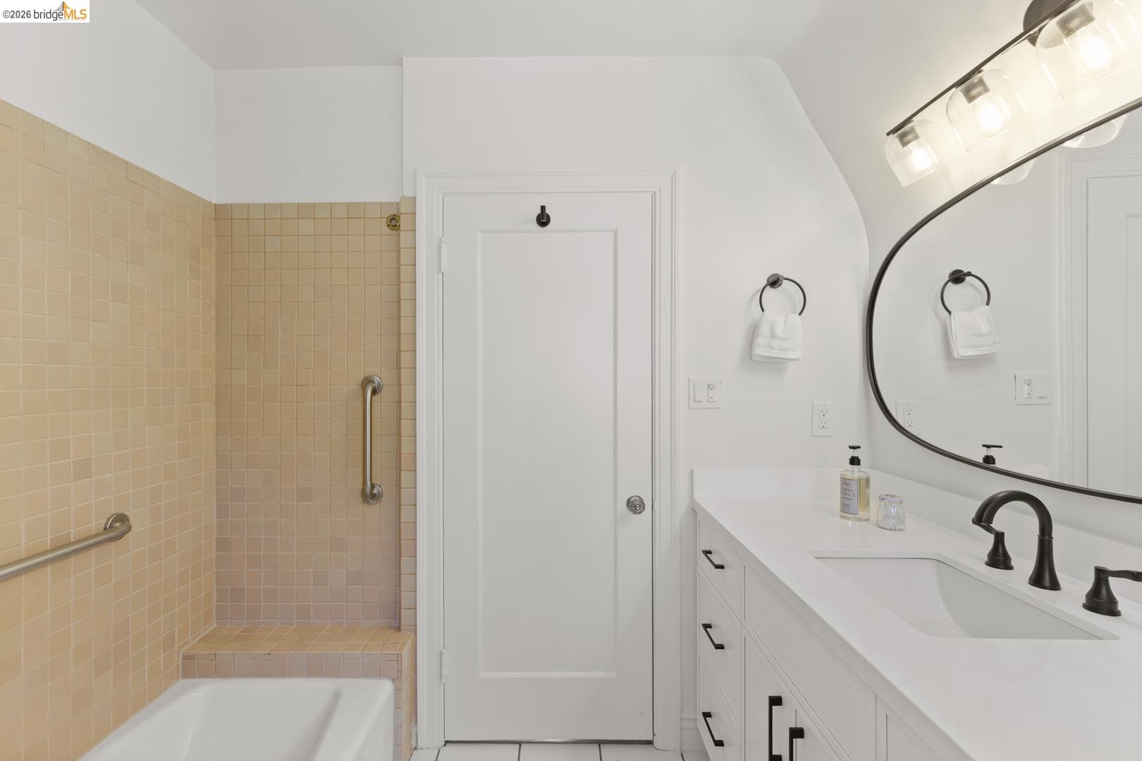 758 Spruce Street Berkeley, CA 94707 - Photo 25 of 60 Bathroom featuring vanity, light tile patterned flooring, a shower, and a tub