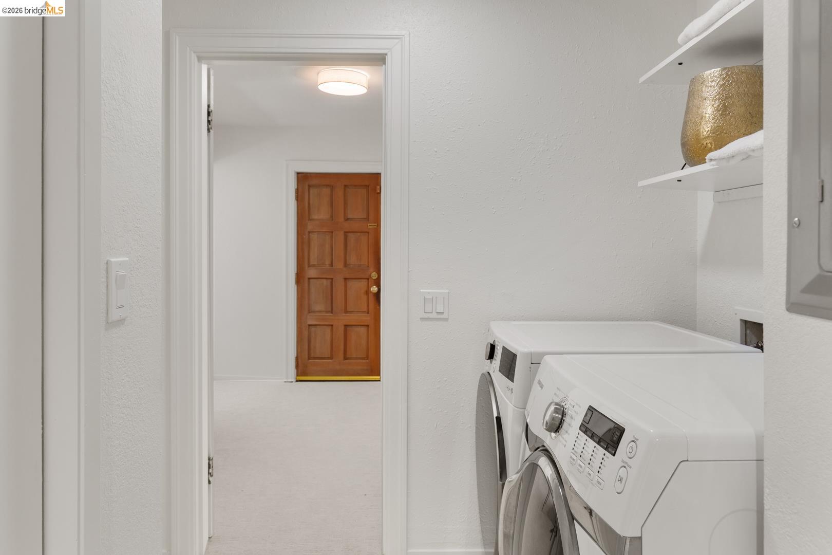 758 Spruce Street Berkeley, CA 94707 - Photo 31 of 60 Laundry room with a textured wall, independent washer and dryer, light carpet, and electric panel